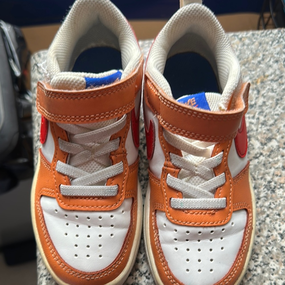 Kids Nike White and Orange Sneakers